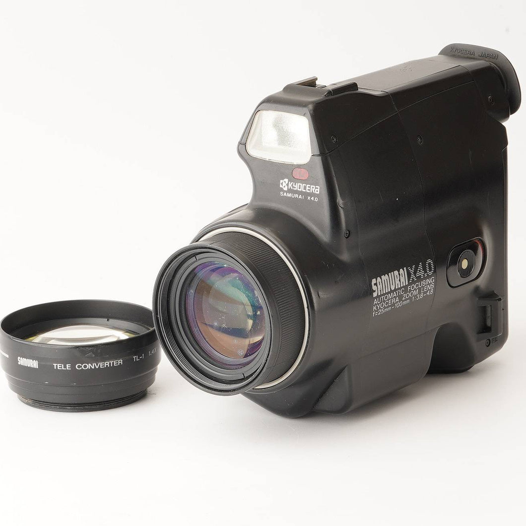 Kyocera SAMURAI X4.0 25-100mm f/3.8-4.8 / Tele Converter TL-1 1.4x