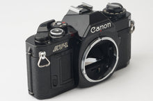Load image into Gallery viewer, Canon AV-1 / Canon New FD 35-70mm f/4
